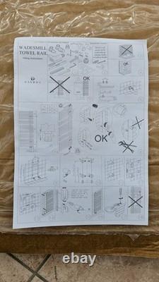 Nouveau sèche-serviettes chauffant blanc design pour salle de bains. Prix public conseillé : 355 £. Chargement latéral, fixation murale.